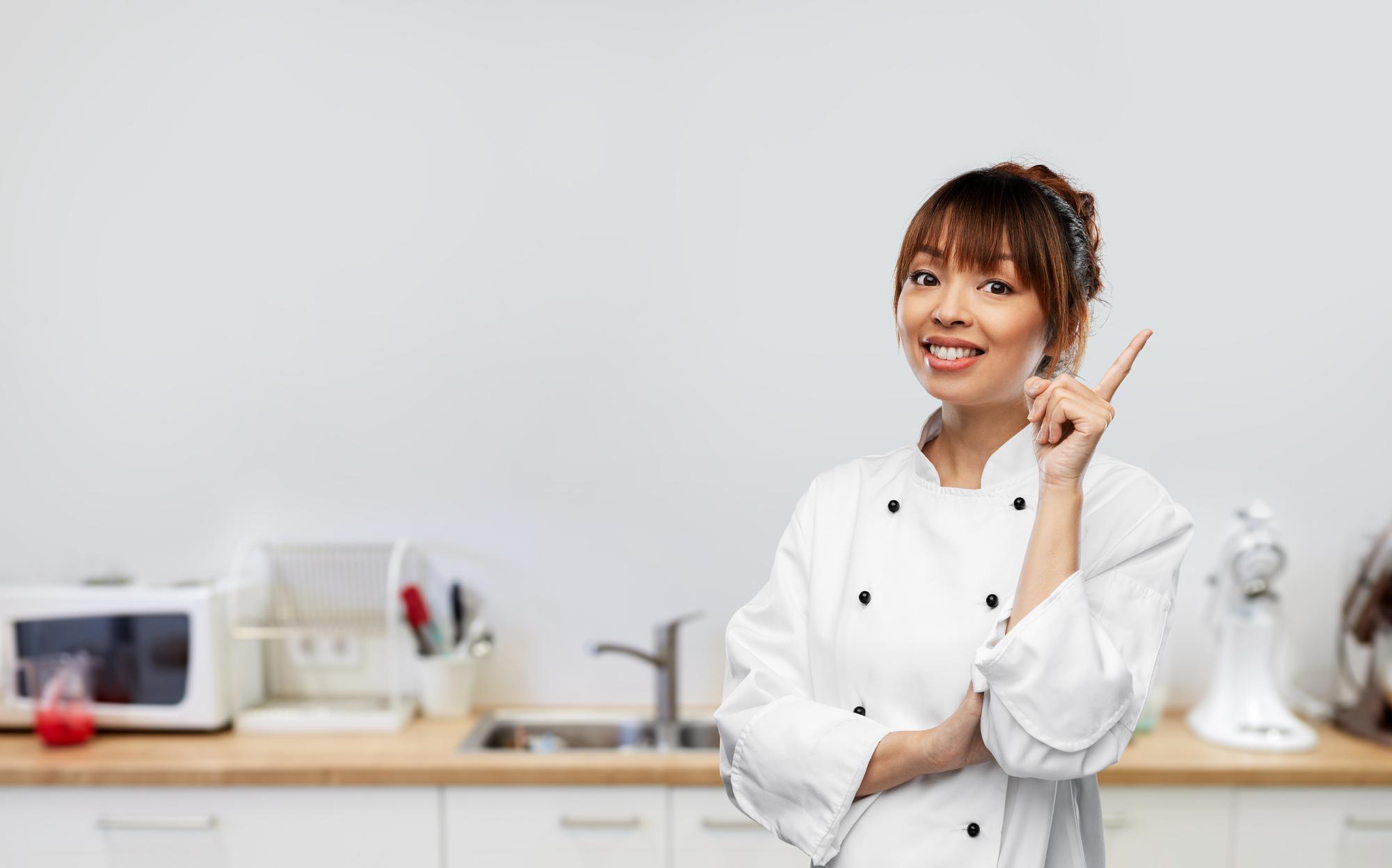 Instructor smiling beside workbench